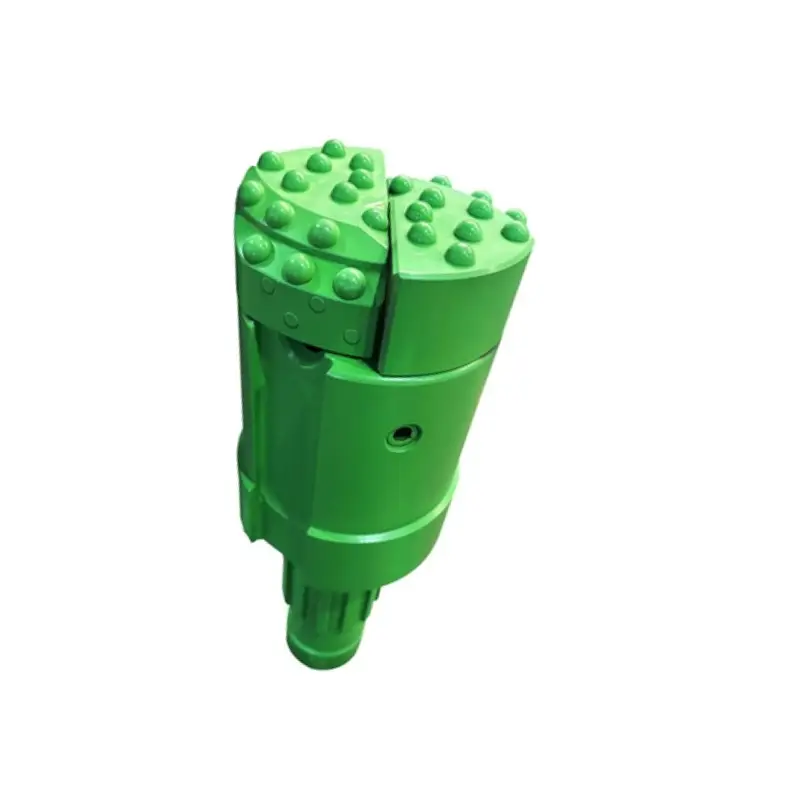 overburden wing bit for eccentric casing system